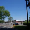 The turning to the right here actually takes all through traffic now: ahead the road is a cul-de-sac. Turning right leads to the New Town estates at Martinscroft. Note the original street lighting on this section.