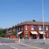 On reaching Fearnhead Lane, the road stops. The road to the left is a New Town development; originally the A574 turned sharp right here. Look closely at the corner of the junction and you can still see the original line of the kerb. It was only altered in 2004.