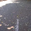 About half a mile on, the old road suddenly reappears, complete with road markings. This section is no more than a hundred yards in length, running past a side turning to a subway under Birchwood Way.
