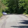 Many of the houses along here are older than the New Town development. While this section was out in the countryside, the north side had a scattering of development. The road here is much wider and, if you look closely, is banked around corners, suggesting a rural main road.