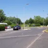 At this roundabout, the A574 (Birchwood Park Avenue) joins from the left and straight ahead is the original A574 out to Leigh. The pre-New Town house on the left is now a shop catering to office workers, named 'Roundabout News'. (I asked, but sadly they didn't have any.)
