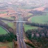 M6 interchange and Cuerden footbridge, view north