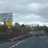Are we on our way now? No, not at all. We cross this antique bridge and both forward lanes are marked out for a right turn to a B-road. Can this be right? A free-flowing motorway junction for this? Motherwell traffic wishing to remain on the A723 must exit to the left.