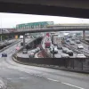 Another view of junction 18 and 19. The tall viaduct spanning this view, behind the unopened footbridge, connects the A804 eastbound to the M8 Kingston Bridge. At the time the photo was taken, it was closed for refurbishment, hence the scaffolding structure covering part of it.