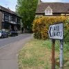 At the other side of the junction, some minimalist signposting shows where all the major roads are now that they have vacated this crossroads.