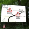 This sign in Surrey is so marvellously complex that it's easy to miss the erroneous appearance of a C-road number.  Photo by Neill Wood