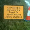 In North Yorkshire, travelling east from Stillington to Sheriff Hutton, a road closure outs this road as the C91.  Photo by Andrew Straw