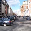North from Cromwell Road is the real shared space. This is the general layout of the street now: the areas to the left and right, where you'd expect footways, are still solely for pedestrians. The middle of the road is marked by occasional traffic islands with showpiece streetlighting. To the left (the west side of the street), there are parking spaces, taxi ranks and so on; to the right two-way traffic. There are almost no kerbs, guardrails or signs.