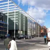 It's hard to argue that the bold black and white paving and tall masts work very well with some of Exhibition Road's more modern buildings.