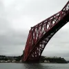 The northern cantilever, with North Queensferry behind it, demonstrates the unbelievable proportions of the structure. The two-track railway is almost lost somewhere amid the steelwork.