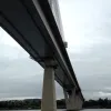 The scale of this bridge is easy to miss, partly because it's so simple and clean in appearance. The deck, supported by narrow concrete piers, is wide enough to carry two lanes of traffic plus full hard shoulders.