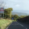 A warning now to try your brakes. In fact the more serious warning about what lies ahead is the second sign — an indication of the first escape lane.