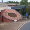 At the bottom of a short hill, a flowerbed welcomes you to Leeds. Many years ago this was a grassy bank with the words "welcome to Leeds" spelled out in flowers, but the new flyover just above it reduced the available space.