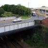 With the flowerbed seen again on the far right, this right-hand corner is the next sharp turn on the route between the M1 and Leeds. Had the original plans been completed there would have been a motorway route coming closer to the city.