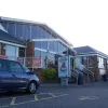 The building itself is completely changed, rebuilt in the 1980s to provide more modern facilities. The service area retains its unique and very basic shape — a car park alongside the motorway with a building at the back — that later service areas rejected.