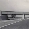 Bridge 74 is a box-shaped metal structure carrying the railway south from Northampton, still in use today. 18 August 1959.