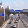 Looking east from the same location, the start of the elevated section is visible, with sliproads to the A5103 Princess Road and the G-Mex exhibition centre. At the time these photos were taken, work was in progress to replace the crash barriers and parapets on the elevated viaduct, hence the roadworks visible here.