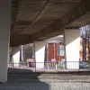 A closer look at the elevated road curving away. On the south side of the motorway are council flats. Few people would be prepared to buy a property this close to the road.