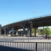 The Downing Street flyover itself — a more slim and graceful structure than the sixties elevated road. Underneath is a very large signalised junction where the A6 and A57 meet the sliproads from the motorway. To the east of this point the road is no longer a motorway, though it is still named Mancunian Way until the next junction along.