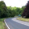 Despite this being the new road built on an entirely new alignment, the worst is still to come: this incredibly tight left-hand turn for southbound traffic, which swings the road through a full 100° turn. This is why there's still only one lane, even though the road is now technically wide enough for two.