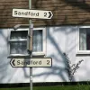 In Devon, all roads lead to Sandford... This pair of wrong-way signs were spotted in Crediton by Colin Price.