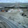 At the other side, the new viaduct is ahead of us. The London-bound off slip swerves across the new carriageway on a temporary line to meet the rest of the junction.