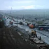 Towards the end of the works, the M2 was transferred onto the new viaduct so that the old one could be renovated for one-way use. It was built as two separate viaducts, and these works were to create a new, single bridge deck across the two sets of supports so that it would support one wide roadway instead of two narrower ones. For the first and possibly last time, the outside lane has been turned into a car park and container yard!