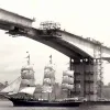 1982. The Orwell Bridge under construction near Ipswich — then for the A45, now carrying the A14. And a rather unusual vessel passing underneath!