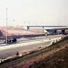 1970. A little further along, the complexity of this three-way interchange becomes apparent. Catenary lighting has already been installed.  Photo by D. Dunwell