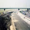 1970. The northern part of the junction, with a gracefully curving flyover reaching ground level to the right. Lane markings are in place, but no hard shoulder.  Photo by D. Dunwell