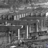 March 1968. To the M40, looking towards London at the elevated viaduct section near High Wycombe. In the foreground is a line that closed two years later — after engineers had worked so hard to accommodate it.  Photo by Robert