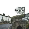 The centre of Kettlewell, North Yorkshire. This one has clearly been added to over the years, but definitely not replaced. The stripey line means that this is the B6160 which leads to the B6265. I can't help but wonder — these signs are embossed with the letters, but the colour is just painted. Do the council still repaint them, or were they just this well made?
