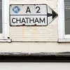 On the same building as the previous picture, this sign points away at right-angles down a different arm of the junction.  Photo by Chris Beckett
