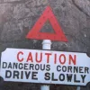 There's plenty to keep you busy on the Isle of Wight — at Carisbrooke Castle there's a bend guarded by these unique signs. They seem to have been carefully preserved and have a coat of fresh paint.  Photo by Ray Harrington