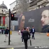 At the north-east corner of the square, one of the many traffic signals shows a red man. But what's not obvious, at least until the lights change, is that his partner the green man is temporarily gone.