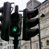 When the lights change, these signals have gender symbols on. Two "venus" symbols are interlinked, in a form that's often used as a shorthand to represent lesbianism.
