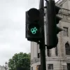 Elsewhere on the same traffic island, two "mars" symbols are linked in the same way to represent gay men.