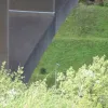 To try to give some idea of the height, here's a small section of the bridge parapet with one of the M62's light columns down below. The lights are huge things — but are only a quarter of the height of the bridge at best.