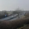 And here is the moment itself — between the two bends seen above, there is an MS1 motorway signal in the central reservation, and a 'start of motorway restrictions' sign at either side. The one on the left hand side has "A1(M)" above the motorway symbol. There is no opportunity for non-motorway traffic to leave the road here, despite people like cyclists and learner drivers having every right to use the road up to that point. There's so little access I couldn't get closer than this to photograph it!