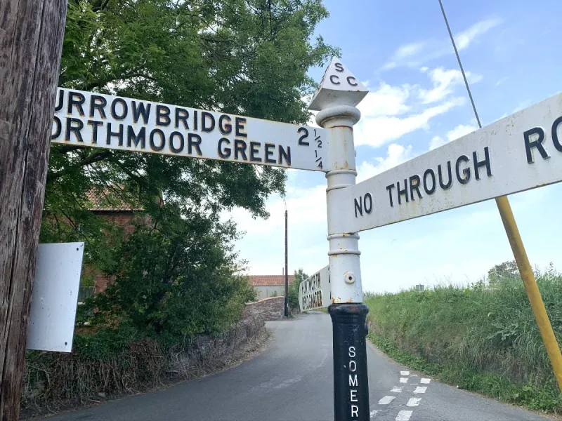 Some SCC fingerposts have these odd black posts with 'Somerset' picked out in white letters. Note also the fact that this post points not to 'Moorland' but to 'Northmoor Green'. Confusing!