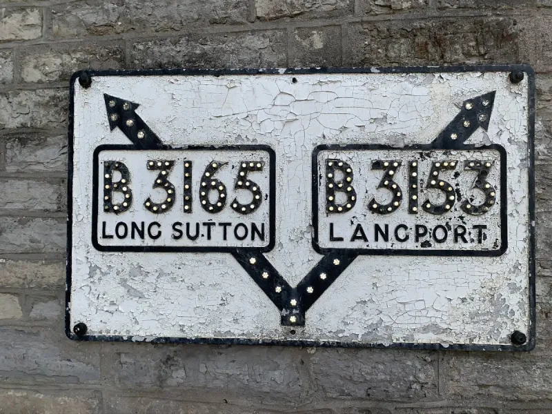 I've saved the best sign I've seen until last. Not far from Tony's fish and chips in Somerton is this beautifully preserved pre-Worboys direction sign. Taken with the camera flash on, just to prove that the reflectors still work (most of them, at least!), this sign not only looks good but still works in all weather conditions. What a beautiful surprise find!