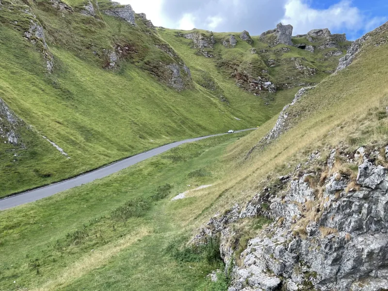 Dwarfed by its surroundings, the road through Winnats Pass. Click to enlarge