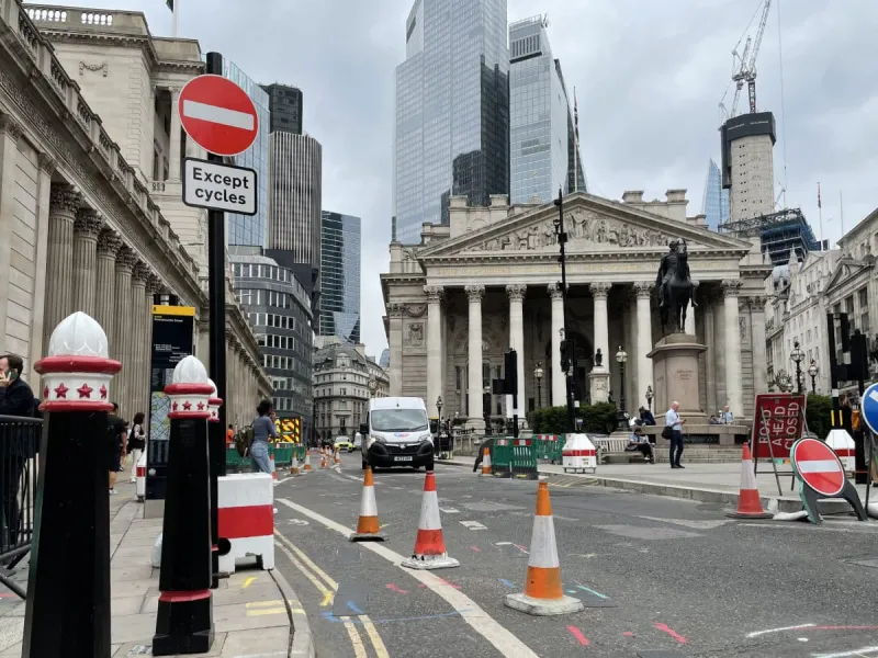 Next to the right is Threadneedle Street. This used to be the A10. Today it is closed entirely to motor traffic. Here the ancient buildings around the Bank have a backdrop of new glassy skyscrapers. Click to enlarge